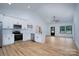 Modern kitchen with stainless steel appliances, white cabinets, subway tile backsplash, and island seating at 315 W Hoke W St, Landis, NC 28088