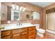 Bathroom with wood vanity, large mirror, white countertop, and shower at 319 Glenhaven Dr, Charlotte, NC 28214