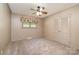 Cozy bedroom with neutral carpet, ceiling fan, and closet with louvered doors at 319 Glenhaven Dr, Charlotte, NC 28214