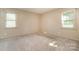 Neutral bedroom with carpet and dual windows with ample natural light at 319 Glenhaven Dr, Charlotte, NC 28214