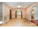 Dining area featuring tile flooring, window with valance and a doorway to another room at 319 Glenhaven Dr, Charlotte, NC 28214