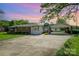 Charming single-story home featuring a brick facade, bay window, and a convenient carport in a serene setting at 319 Glenhaven Dr, Charlotte, NC 28214