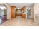 Traditional kitchen with tile flooring, wooden cabinets, and stainless steel refrigerator at 319 Glenhaven Dr, Charlotte, NC 28214