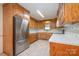 Well-equipped kitchen with stainless steel appliances, abundant cabinetry, and bright tile backsplash at 319 Glenhaven Dr, Charlotte, NC 28214