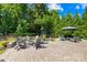Spacious brick patio featuring a built-in fire pit, outdoor kitchen, and separate seating for gatherings at 3918 Halcyon Dr, Huntersville, NC 28078