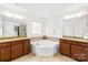 Bright bathroom with double vanity, granite countertops, and tiled backsplash at 3918 Halcyon Dr, Huntersville, NC 28078