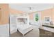 Bright bedroom with a bunk bed, and a window letting in natural light at 3918 Halcyon Dr, Huntersville, NC 28078