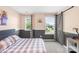 Comfortable bedroom with gray walls, two windows, and a sliding barn door at 3918 Halcyon Dr, Huntersville, NC 28078