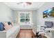 Bright bedroom featuring a daybed, desk, and backyard view from the large window at 3918 Halcyon Dr, Huntersville, NC 28078
