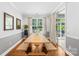 Bright dining room with long table, benches, and sliding door to the backyard at 3918 Halcyon Dr, Huntersville, NC 28078