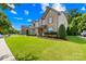 Beautiful two-story home with a well-manicured lawn, lush landscaping, and inviting curb appeal at 3918 Halcyon Dr, Huntersville, NC 28078