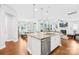 Gourmet kitchen with island seating and modern appliances opens to the living area at 3918 Halcyon Dr, Huntersville, NC 28078