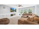 Spacious living room with a large screen TV, a comfortable couch, and built-in shelves at 3918 Halcyon Dr, Huntersville, NC 28078