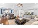 Comfortable seating in the living room leading to a dining area with blue accents at 3918 Halcyon Dr, Huntersville, NC 28078