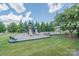 Community playground with slides, swings, and picnic area set in a grassy, tree-lined space at 3918 Halcyon Dr, Huntersville, NC 28078