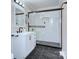 Bathroom featuring modern white vanity, hexagon tile floor and glass shower door at 3951 Whitehall Dr, Charlotte, NC 28208