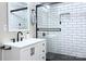 Modern bathroom boasts a sleek vanity and walk-in shower with black accents at 3951 Whitehall Dr, Charlotte, NC 28208