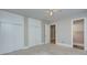 Neutral bedroom features carpet, built-in storage, and access to a bathroom at 3951 Whitehall Dr, Charlotte, NC 28208
