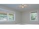 Bedroom with two windows and ceiling fan, providing ample natural light at 3951 Whitehall Dr, Charlotte, NC 28208