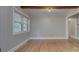 Bedroom features hardwood floors, neutral walls, wood beam ceiling, and a window at 3951 Whitehall Dr, Charlotte, NC 28208