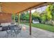 Covered patio, outdoor seating, large backyard with storage shed at 3951 Whitehall Dr, Charlotte, NC 28208