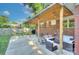 Covered patio with string lights and comfortable outdoor seating area at 3951 Whitehall Dr, Charlotte, NC 28208