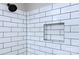 Walk-in shower with subway tile surround and a built-in storage nook at 3951 Whitehall Dr, Charlotte, NC 28208