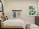 Bedroom with a large window and a comfortable bed with a bench at 4179 Skyboat Cir, Fort Mill, SC 29715