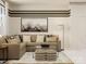 Comfortable living room with sectional sofa, contemporary artwork, and soft lighting at 4179 Skyboat Cir, Fort Mill, SC 29715