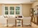 Bright living room features neutral décor and three large windows providing ample natural light at 4179 Skyboat Cir, Fort Mill, SC 29715