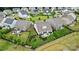 Aerial view of a home showcasing a private backyard with a patio, fire pit, and mature landscaping at 4527 Waylon Ave, Fort Mill, SC 29715