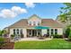 Spacious backyard featuring a patio, lush green grass, and manicured landscaping at 4527 Waylon Ave, Fort Mill, SC 29715