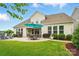 Enjoy outdoor dining on the spacious backyard patio with a large umbrella and well-manicured landscaping at 4527 Waylon Ave, Fort Mill, SC 29715