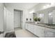 Bathroom with granite countertop, white cabinetry, and modern fixtures at 4527 Waylon Ave, Fort Mill, SC 29715