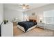 Comfortable bedroom with tufted headboard, dark bedding, and stylish bedside tables at 4527 Waylon Ave, Fort Mill, SC 29715