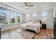Spacious bedroom filled with natural light, wood floors, and tray ceiling at 4527 Waylon Ave, Fort Mill, SC 29715