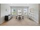 Upstairs bonus room with plush carpet, bar, table, chairs and built-in shelving at 4527 Waylon Ave, Fort Mill, SC 29715