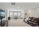 Expansive bonus room with comfortable seating, a bar area, and plenty of natural light at 4527 Waylon Ave, Fort Mill, SC 29715