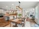Dining area with open-concept layout, featuring seamless flow into the kitchen and a cozy living room at 4527 Waylon Ave, Fort Mill, SC 29715