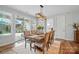 Well-lit dining room with access to the backyard patio and direct entry to an adjacent bedroom at 4527 Waylon Ave, Fort Mill, SC 29715