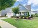 Beautifully landscaped front yard with a variety of plants and shrubs, enhancing the home's curb appeal at 4527 Waylon Ave, Fort Mill, SC 29715