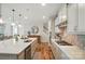 Well-lit kitchen featuring ample counter space, updated appliances, and seamless flow to other living spaces at 4527 Waylon Ave, Fort Mill, SC 29715