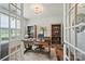 Bright home office with hardwood floors, stylish desk, shelving, and a decorative light fixture at 4527 Waylon Ave, Fort Mill, SC 29715