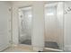 Bathroom featuring tiled walk-in showers with glass doors and gray tile floors at 4527 Waylon Ave, Fort Mill, SC 29715