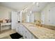 Elegant bathroom with a dual sink vanity, granite counters, and pendant lighting at 469 Valley Run Dr, Waxhaw, NC 28173
