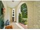 Charming arched front porch featuring elegant decor, patterned rugs, and scenic views at 469 Valley Run Dr, Waxhaw, NC 28173