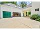 Open garage with custom kitchen space and adjacent open carport area at 469 Valley Run Dr, Waxhaw, NC 28173