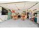 Finished garage space with seating area, decor, and epoxy floor at 469 Valley Run Dr, Waxhaw, NC 28173