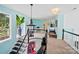 Bright hallway with a staircase, black handrails, and a large window with a view at 469 Valley Run Dr, Waxhaw, NC 28173