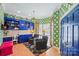 Inviting home office featuring built-in cabinets, patterned wallpaper, and a cozy seating area at 469 Valley Run Dr, Waxhaw, NC 28173